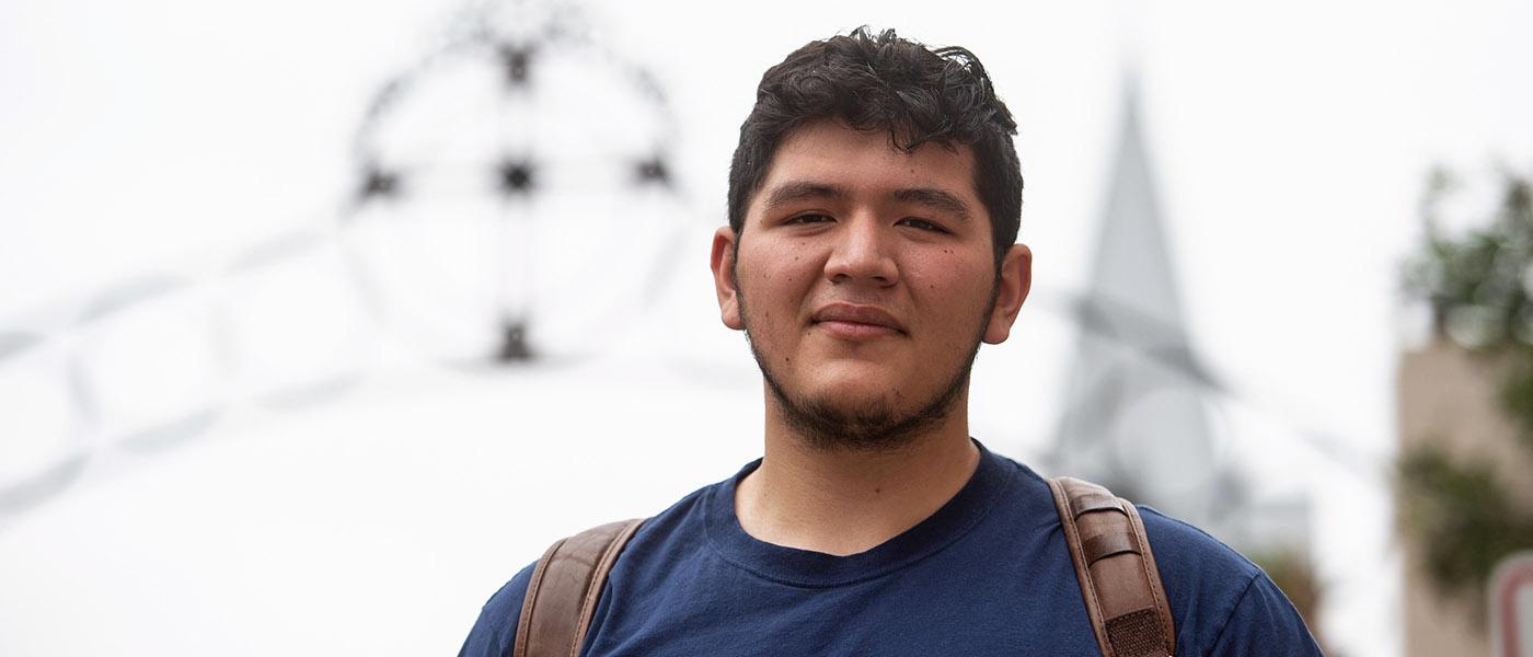 Ministry student close up with crucifix in the background